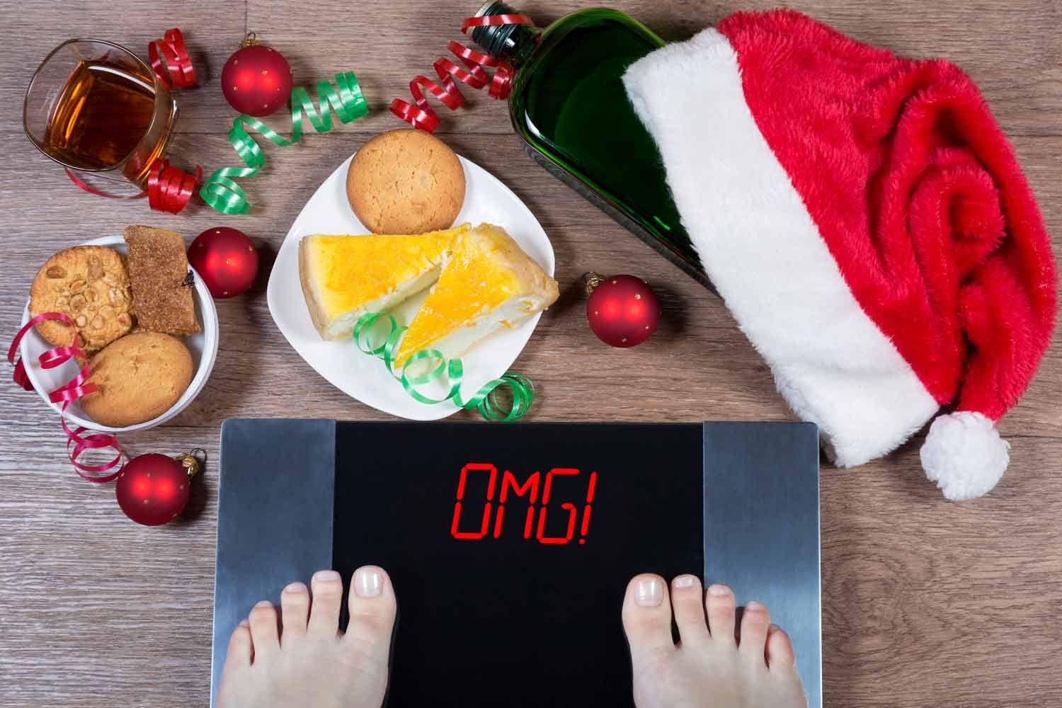 person weighing themselves after holiday eating