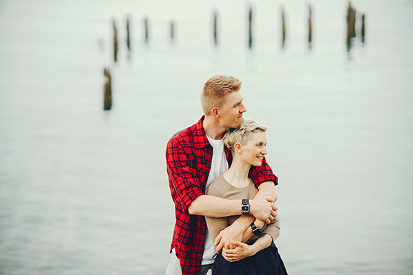 happy couple near ocean